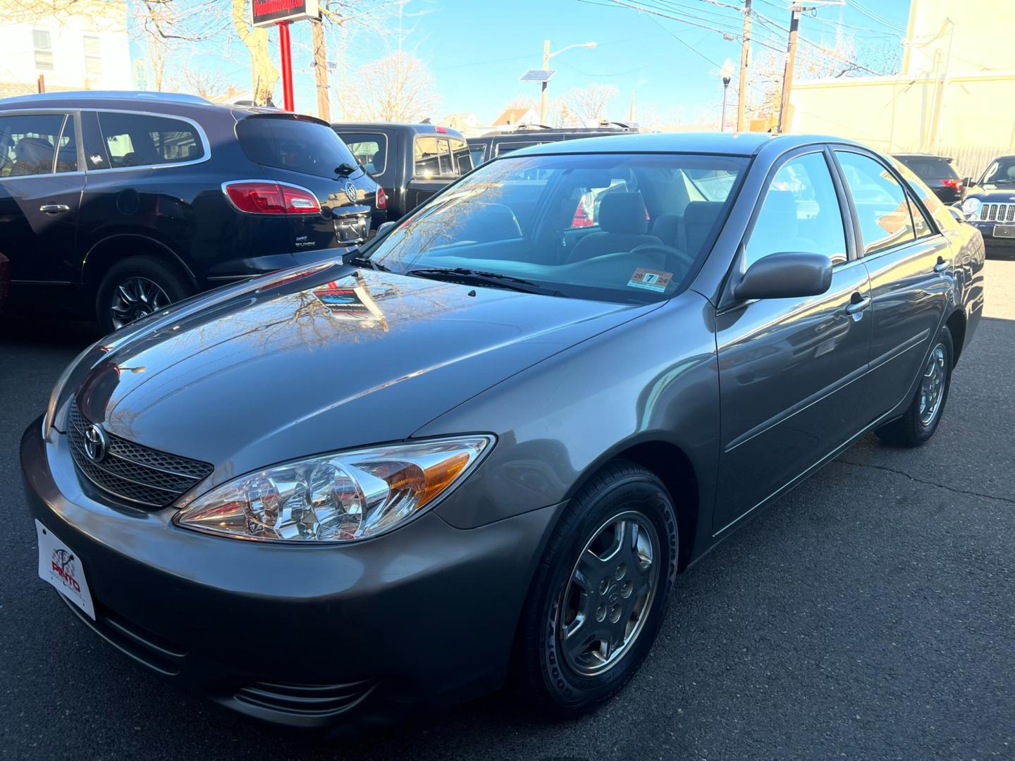 2003 charcoal /beige Toyota Camry LE (4T1BE32K63U) with an 2.4L L4 DOHC 16V engine, located at 1018 Brunswick Ave, Trenton, NJ, 08638, (609) 989-0900, 40.240086, -74.748085 - Photo#0